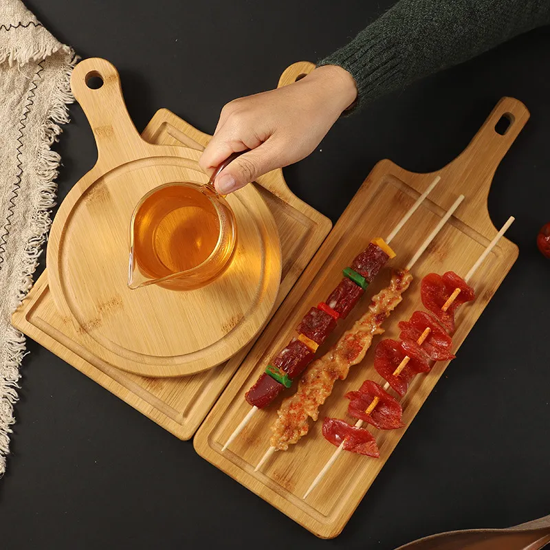 frutas, pan y queso, redonda de bamb&uacute; sostenible con asa 