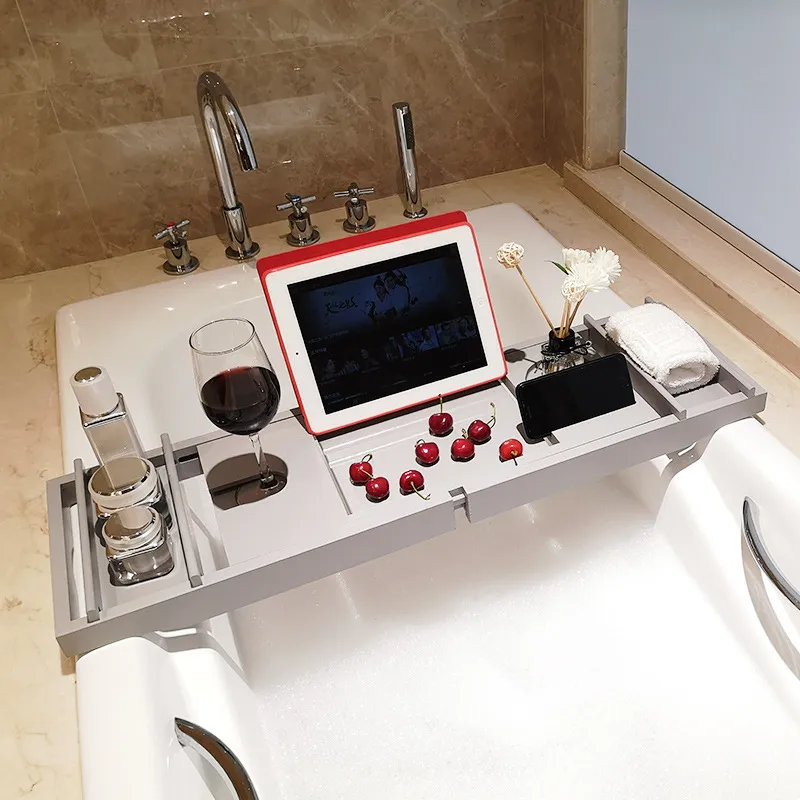 Bandeja extensible de bamb&uacute; para ba&ntilde;era de color gris con soporte para libros y vino 
