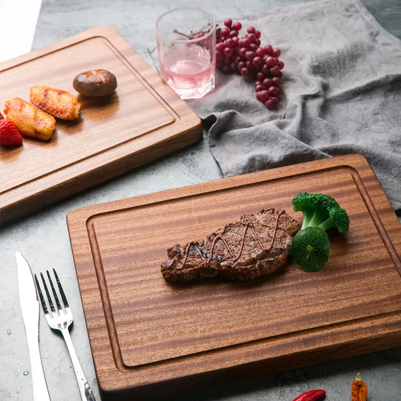 Tabla de cortar rectangular de madera de &eacute;bano con ranura para jugo