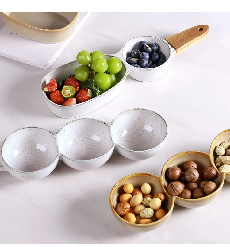 Plato de cer&aacute;mica para frutos secos y plato para aperitivos de estilo europeo creativo con mango de madera 