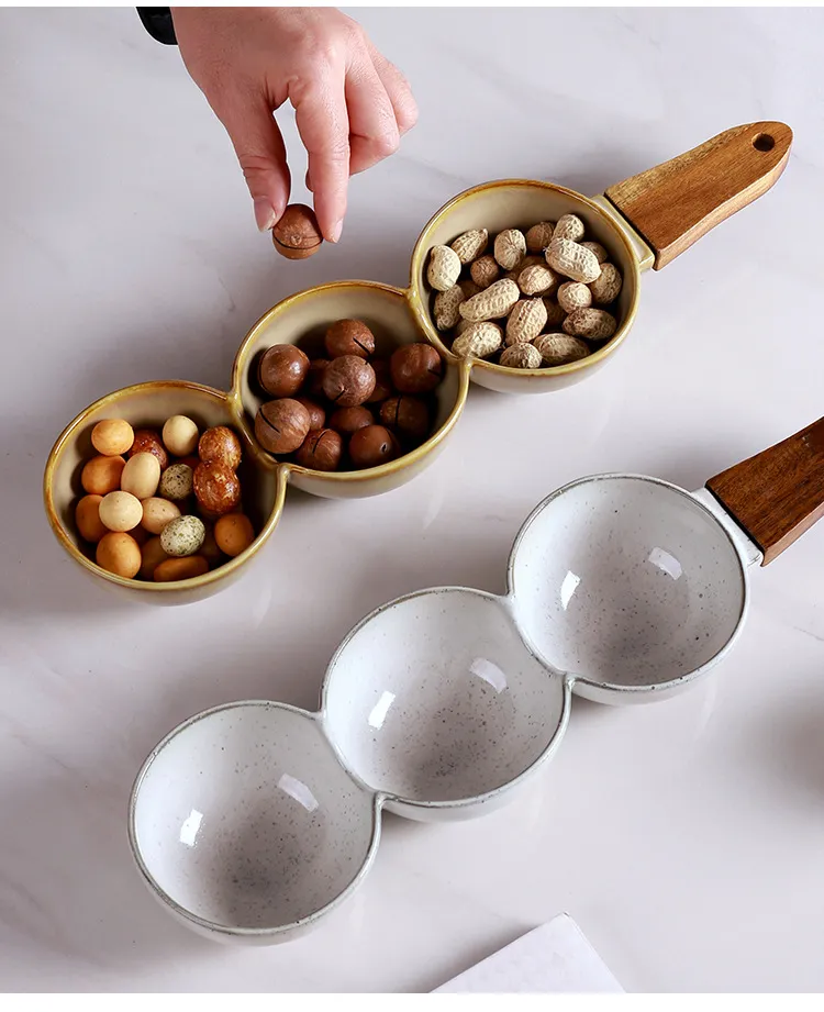 Plato de cer&aacute;mica para frutos secos y plato para aperitivos de estilo europeo creativo con mango de madera Plato de cer&aacute;mica para frutos secos y plato para aperitivos de estilo europeo creativo con mango de 